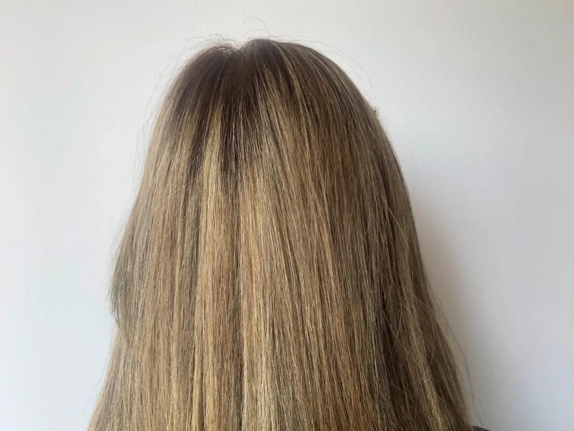 After: the same client’s hair toned to a softer, darker blonde and blended into the roots